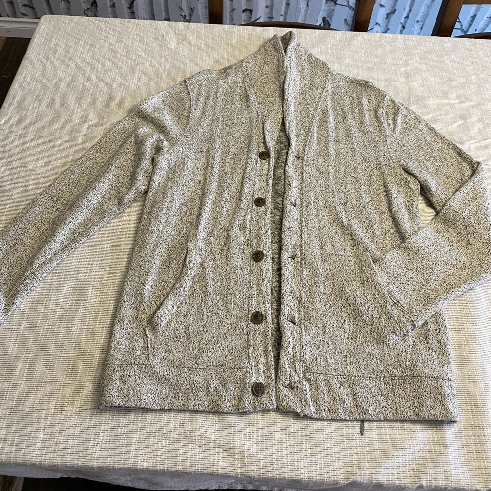 Grey and black light spotted sweater.